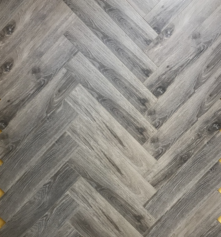 12mm Herringbone Grey Ash Eir Best, Grey Ash Laminate Flooring